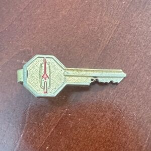 Vintage Oldsmobile 1960s Gold colored Key Tie Clip with Red Accent